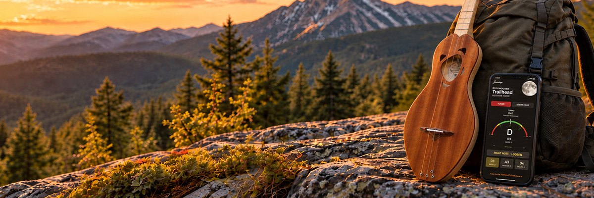 A Boondocker Trailhead leaning against a pack on a ridge at sunset, beside a phone running the Trailhead tuner