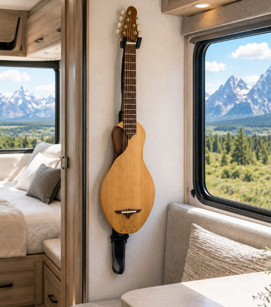Boondocker G3 Travel Guitar hanging in an RV overlooking the mountains
