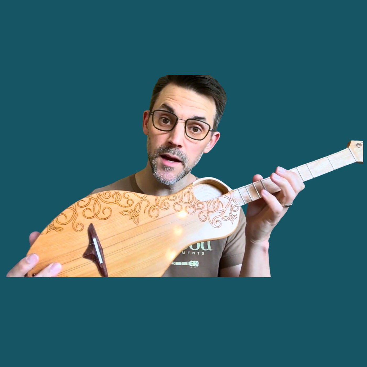 Musician with a Boondocker dulcimer guitar — Inglewood lesson partnership